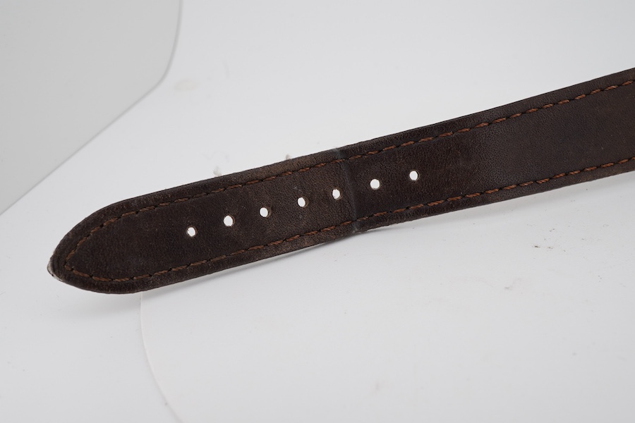 A gentleman's 1950's stainless steel Timor manual wind wrist watch, with Arabic and baton numerals dial and subsidiary seconds, on a later associated strap, case diameter 34mm, case back with engraved personal inscriptio